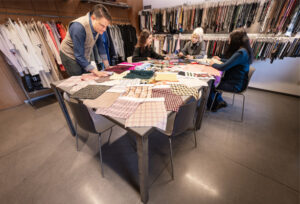 Overseas Textile Services team working in the office